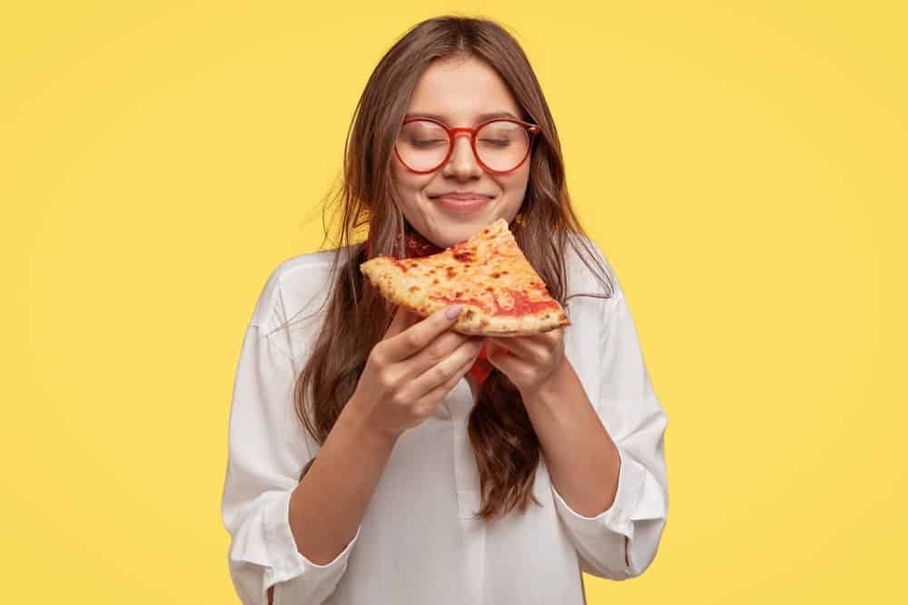 girl eating pizza